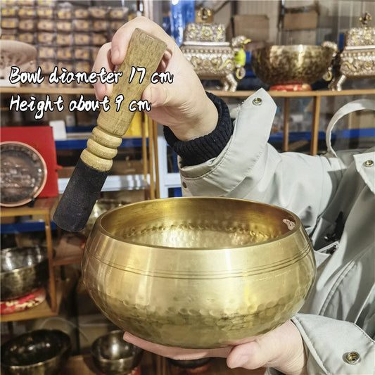 Tibetan brass singing bowl with Sanskrit – handmade meditation instrument for stress relief.